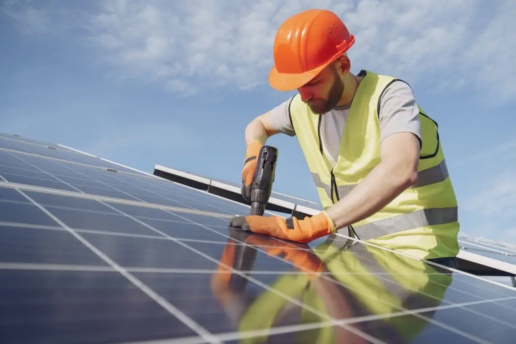 Male worker with solar batteries.